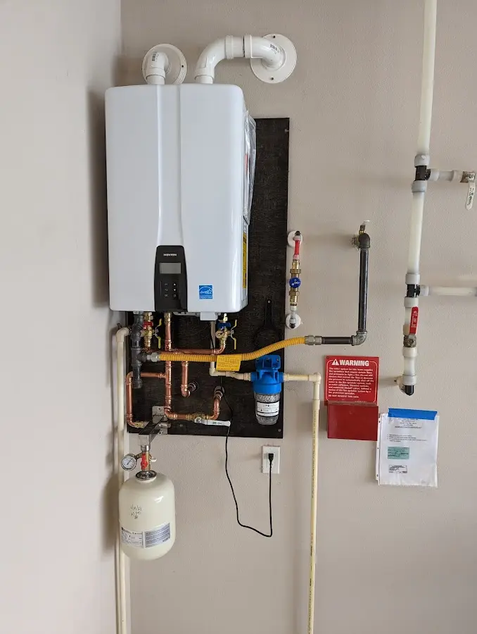 Professional plumber installing copper piping in a West DeLand home